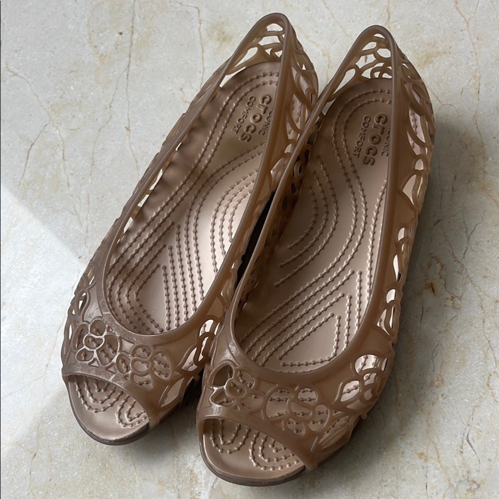 Like New CROCS Brown Flats with Intricate Cut-Out Design